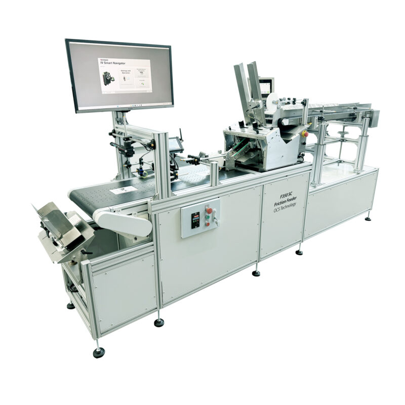 Complete pre-packaging line equipped with our unique autoloading system, ideal for high-output production. -The system shows the preloader, a friction feeder, and a vacuum conveyor equipped with a high-speed inspection system.